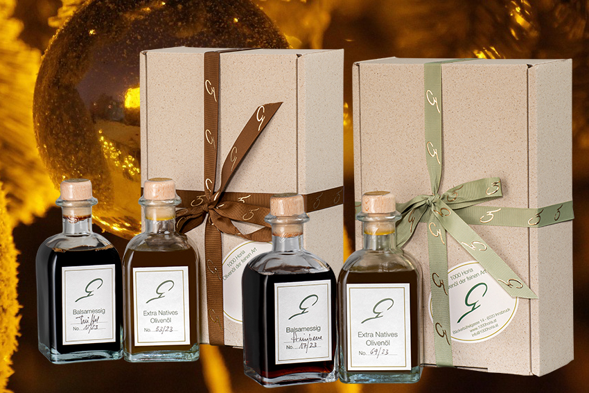 Zwei Geschenkpakete mit Essig und Olivenöl